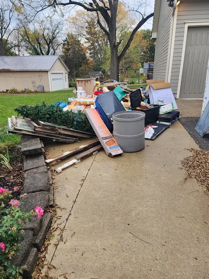 Dumpster being loaded with debris for 3 Yard Dumpster Rental in Panama City